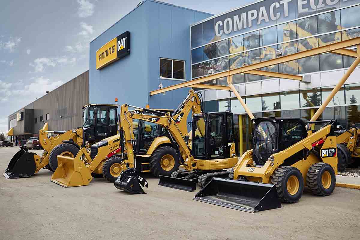 Finning Caterpillar heavy equipment lined up outside a Finning branch
